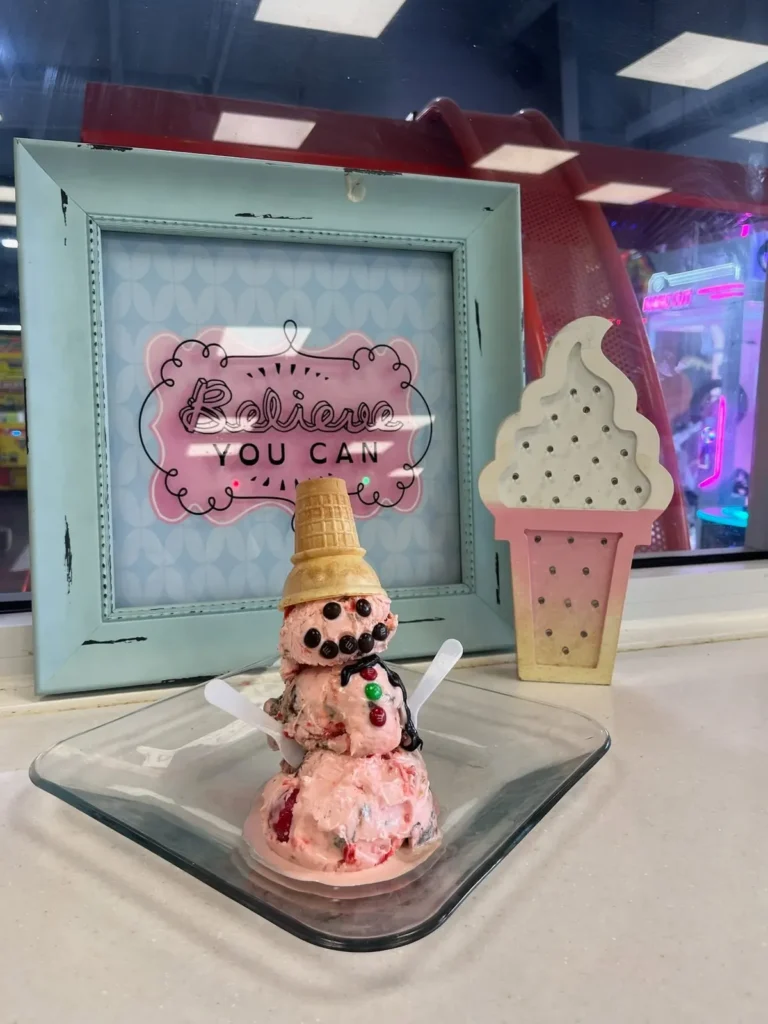 Ice cream cone decor and sign inside Tots Ice Cream