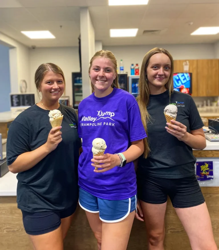Tots Ice Cream team holding ice cream cones