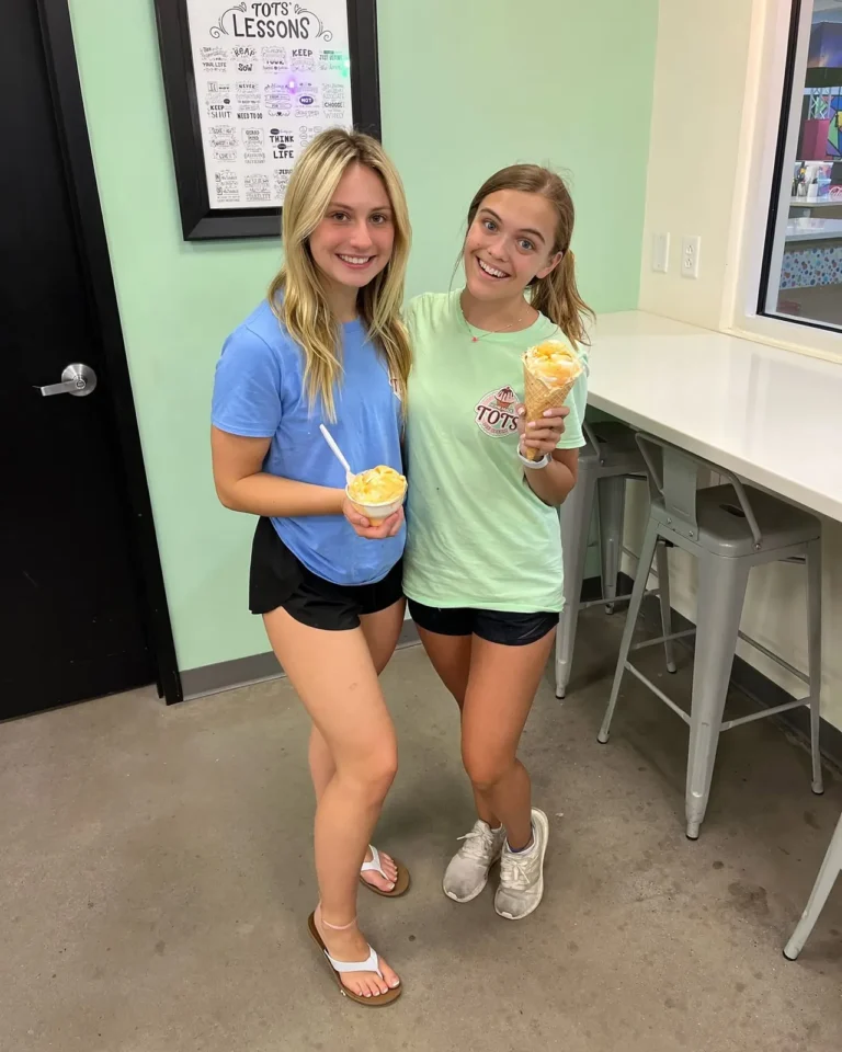 Two Tots Ice Cream team members holding cones