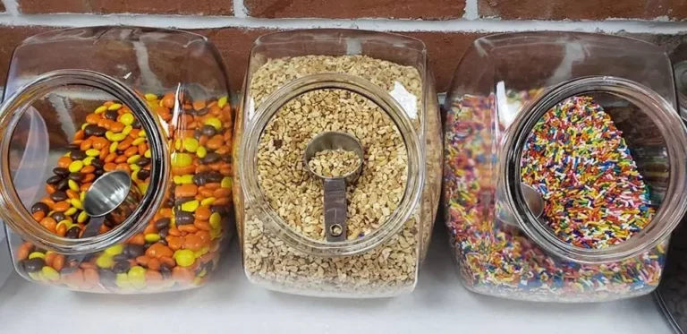Jars of candy, nut and rainbow sprinkle toppings at Tots Ice Cream